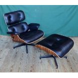 A late 20th century leather upholstered rosewood reclining swivel armchair and ottoman,