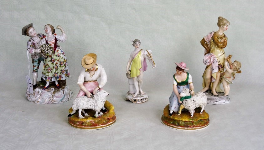 A collection of five 19th century and later porcelain figure groups,