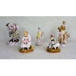 A collection of five 19th century and later porcelain figure groups,