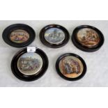 A collection of five wooden framed Prattware pot lids,