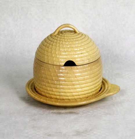 A 19th century Wedgwood honey/preserve pot, modelled as a beehive, cream glaze finish,