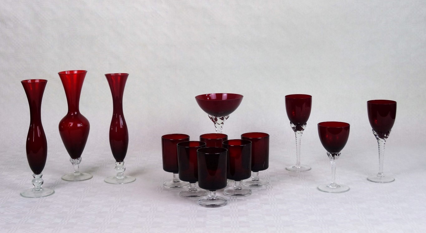 A quantity of ruby coloured glassware, to include: spill vases, wine glasses and others.