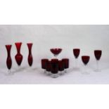 A quantity of ruby coloured glassware, to include: spill vases, wine glasses and others.