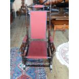 A late Victorian mahogany upholstered rocking chair, 56cm wide.