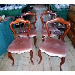 A set of four Victorian balloon back dining chairs on front cabriole supports, 46cm wide.