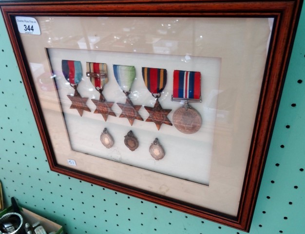 A framed and glazed WWII medal presentation group, to include: Campaign medal, 1939/45 Star,