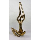 A large African gilt metal (possibly bronze) abstract study of a female seated figure with