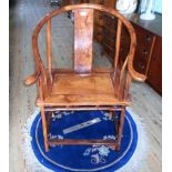 An Oriental rosewood hoop back armchair, 66cm wide.
