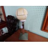 An Art Deco-style table lamp, having geometric shaped globe,