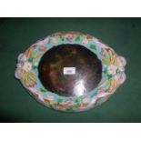 A Victorian Majolica oval dish, having relief decoration of fruit and leaves,