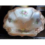 A large Edwardian blush ivory wash bowl, having foliate decoration and gilt finish, 47cm wide.