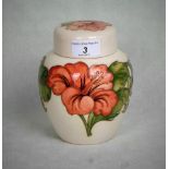 A Moorcroft ginger jar in the Peach Hibiscus pattern,