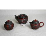 A three piece Chinese terracotta and pewter mounted tea set, comprising: teapot,