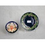 Two contemporary Moorcroft dishes, each having tube-lined floral decoration,