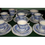 A blue and white part-tea service, a six place setting, comprising: trios, sandwich plates,