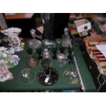 A mixed quantity of glassware, to include: decanters, vases, green wine glasses,