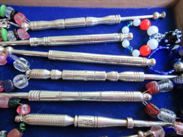 A collection of fourteen silver lace making bobbins,