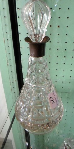 A glass decanter with silver collar, London hallmarks 1942, 31cm.