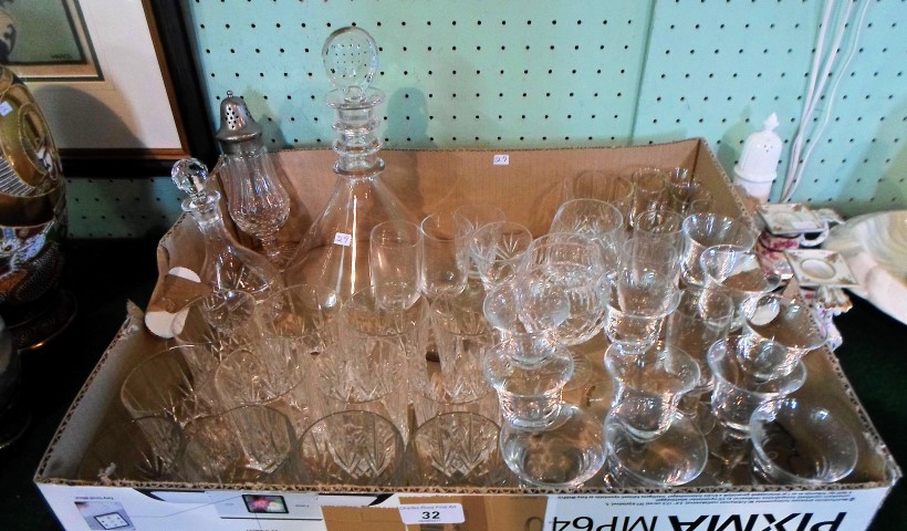 A quantity of glassware to include: a decanter of conical form, pedestal sugar sifter,