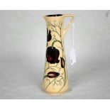 A contemporary Moorcroft small jug, having tube-lined decoration of purple flowers,