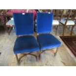 A pair of blue upholstered bedroom chairs, united by X-stretcher, 41cm wide.