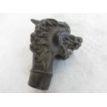 A bronze walking cane handle formed as a mythical beast, 7cm.