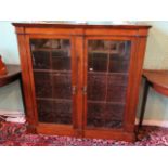 A Victorian rosewood two door bookcase, 116cm wide.
