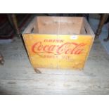 A mid-20th century Coca-Cola wooden drinks crate, 42cm wide.