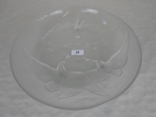 A French-style pressed glass open bowl, decorated with birds and fish, 34cm diameter.