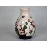 A contemporary Moorcroft vase in the Grape Hyacinth pattern, painted and impressed marks to base,