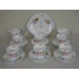 An early 20th century Shelley bone china part-tea service, in the Wild Flowers pattern,
