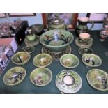 A quantity of Portuguese green glazed and hand painted tableware, to include: covered tureen, bowls,