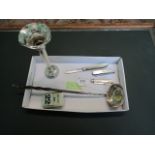 A white metal toddy ladle, having horn handle and inset coin,