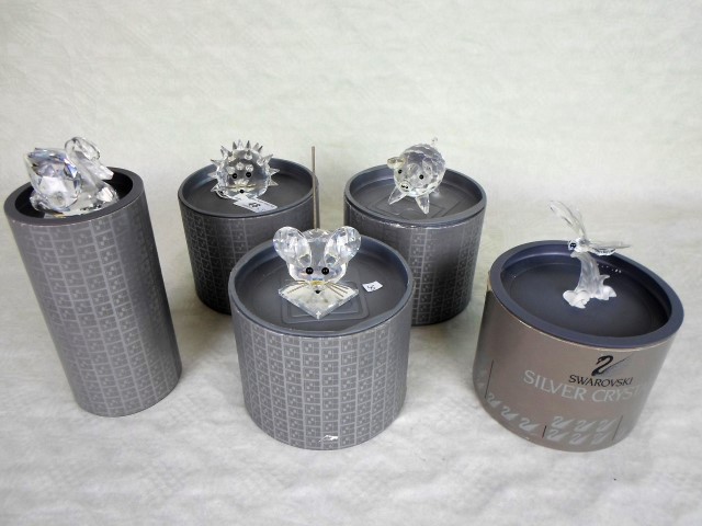 Five Swarovski crystal animals, each in original box, to include: a dragonfly, mouse, swan,