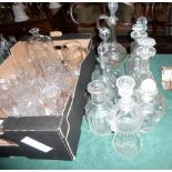 A mixed quantity of cut and pressed glass decanters, early 20th century and later, the tallest 35cm.