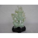 A Chinese Celadon jade carved vase and cover formed as a dragon, 17cm,