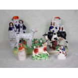A collection of seven Staffordshire ceramic figures, to include: animals,