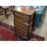 A reproduction walnut narrow six drawer chest, 43cm wide.