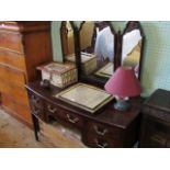 A reproduction bow fronted dressing table, having triptych mirror,