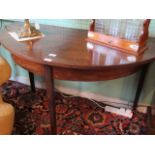 A pair of Georgian mahogany demi-lune side tables, formerly a dining table, with extra leaf present,