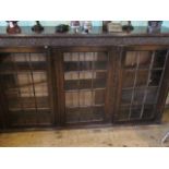 An early 20th century oak three door bookcase, 152cm wide.