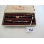 A Wyvern 14ct gold nibbed fountain pen, the lever fill case having marble-style decoration,