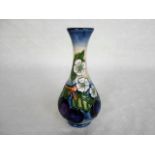 A contemporary Moorcroft vase, having a tube-lined decoration of fruit and foliage,