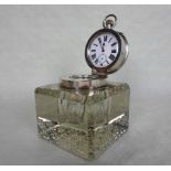 Asprey, a cut glass inkwell of square form, having silver hallmarked mounts for Asprey,