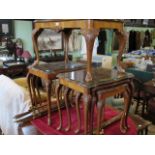 Two sets of three walnut veneered nesting tables,