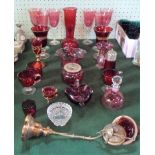 A large quantity of cranberry coloured glass, to include: vases, a scent bottle,