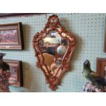 A reproduction gilt framed French-style mirror, 61cm x 36cm.