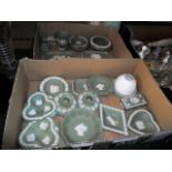 Two boxes containing a collection of Wedgwood Jasperware, the majority on a sage green ground,