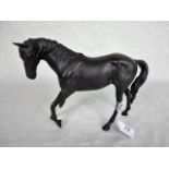 A Beswick model of a horse, Black Beauty, matt black finish, 17.5cm tall.