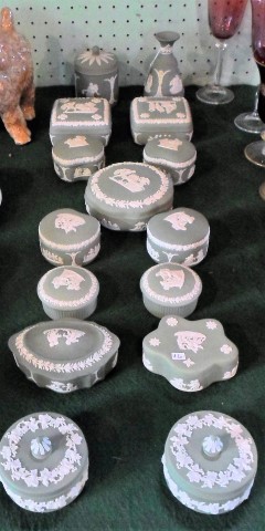 Fifteen items of Wedgwood Jasperware, each on a sage green ground,